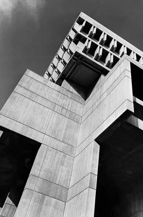 black and white image of a concrete brutalist style building